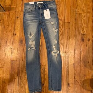 Ripped, light wash skinny jeans